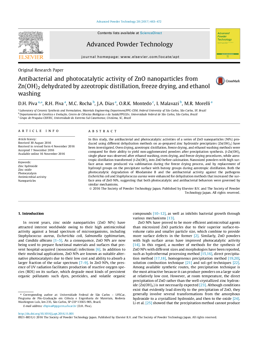 Antibacterial and photocatalytic activity of ZnO nanoparticles from Zn(OH)2 dehydrated by azeotropic distillation, freeze drying, and ethanol washing