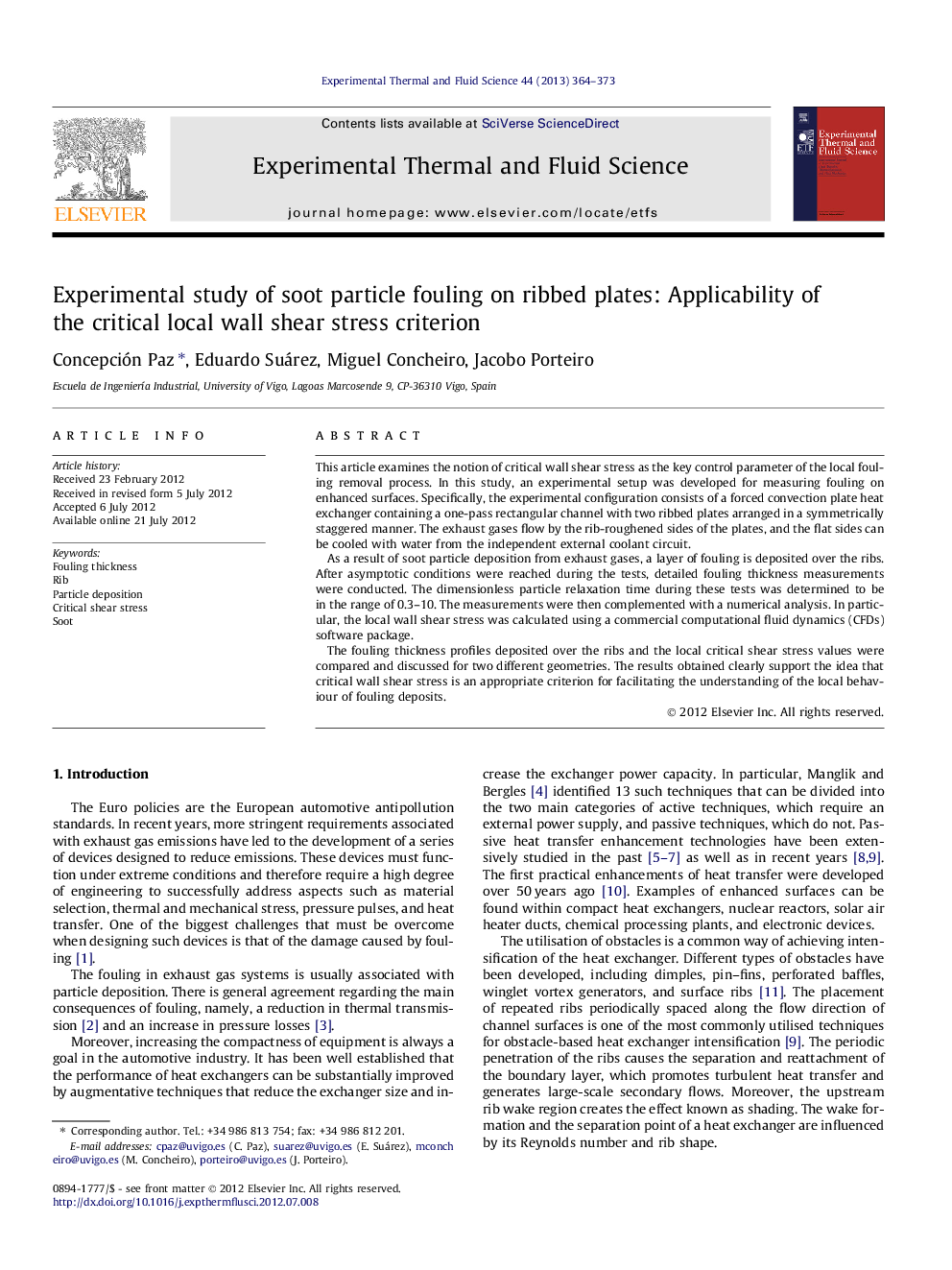 Experimental study of soot particle fouling on ribbed plates: Applicability of the critical local wall shear stress criterion