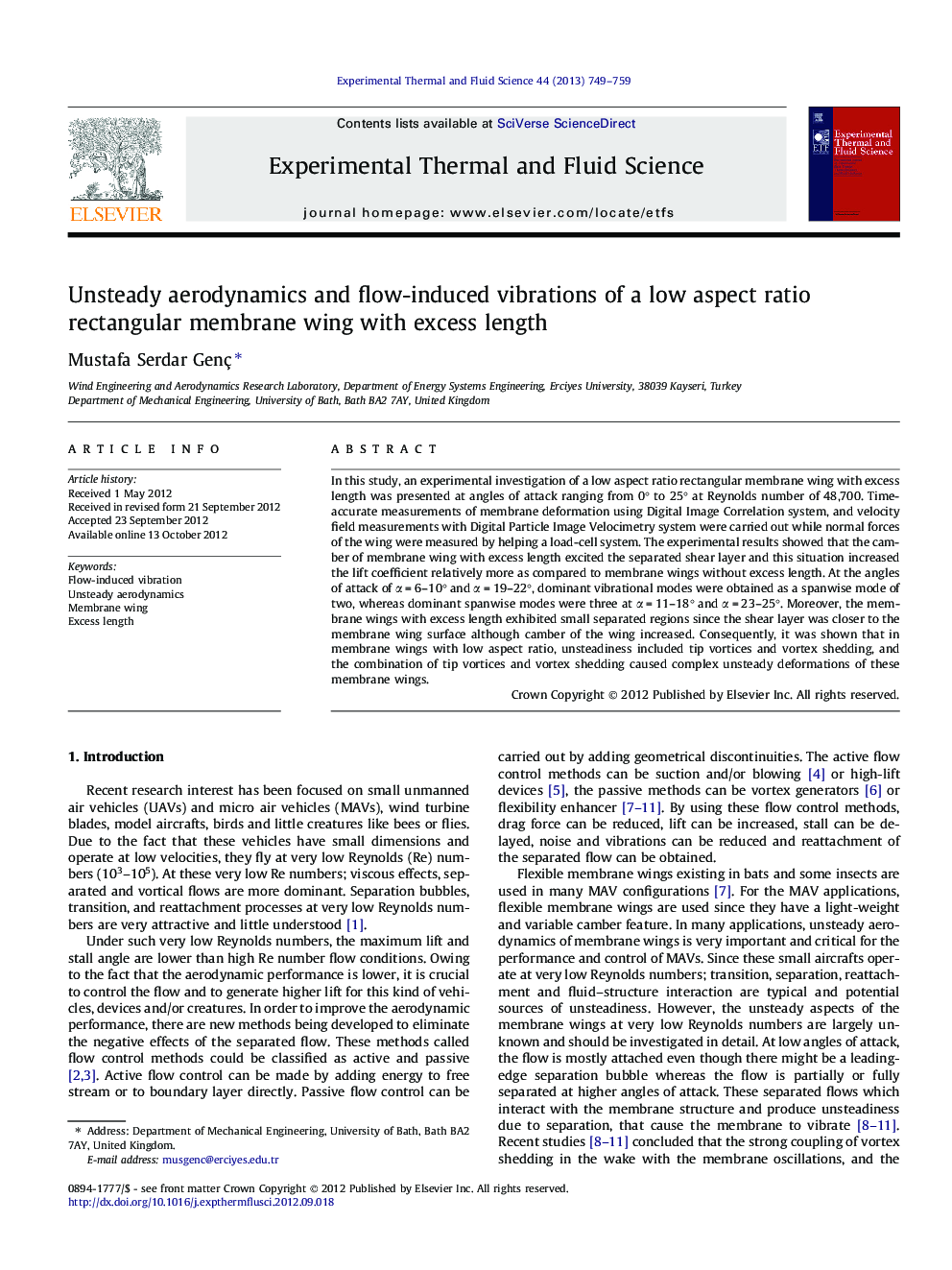 Unsteady aerodynamics and flow-induced vibrations of a low aspect ratio rectangular membrane wing with excess length