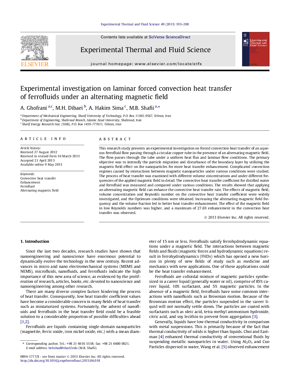 Experimental investigation on laminar forced convection heat transfer of ferrofluids under an alternating magnetic field