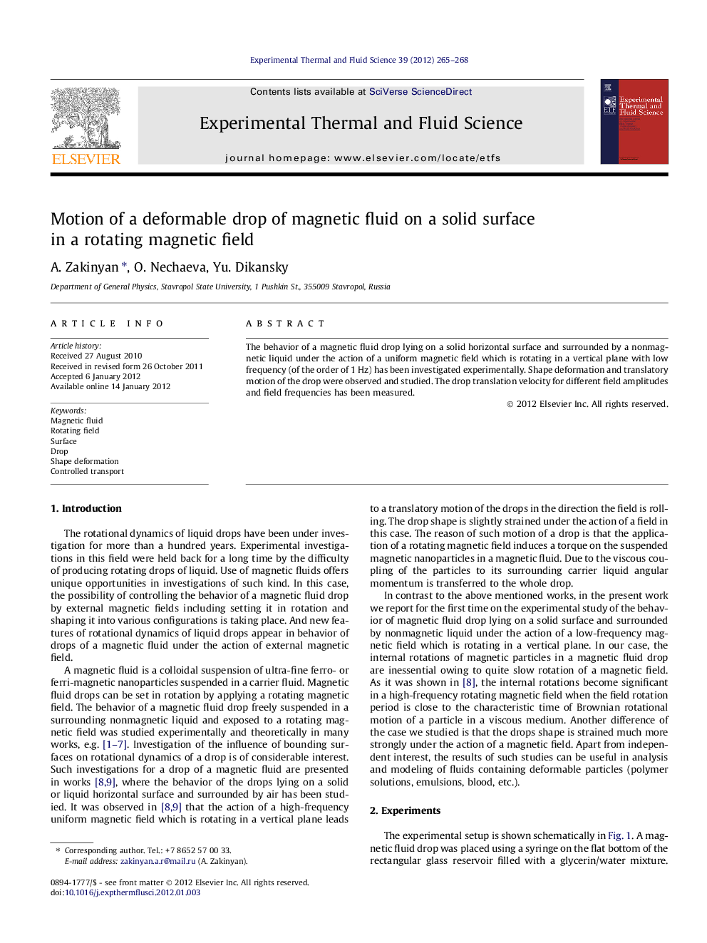 Motion of a deformable drop of magnetic fluid on a solid surface in a rotating magnetic field