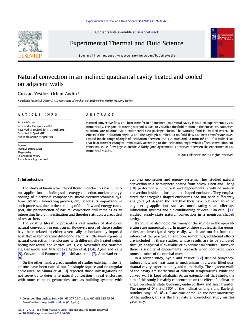 Natural convection in an inclined quadrantal cavity heated and cooled on adjacent walls