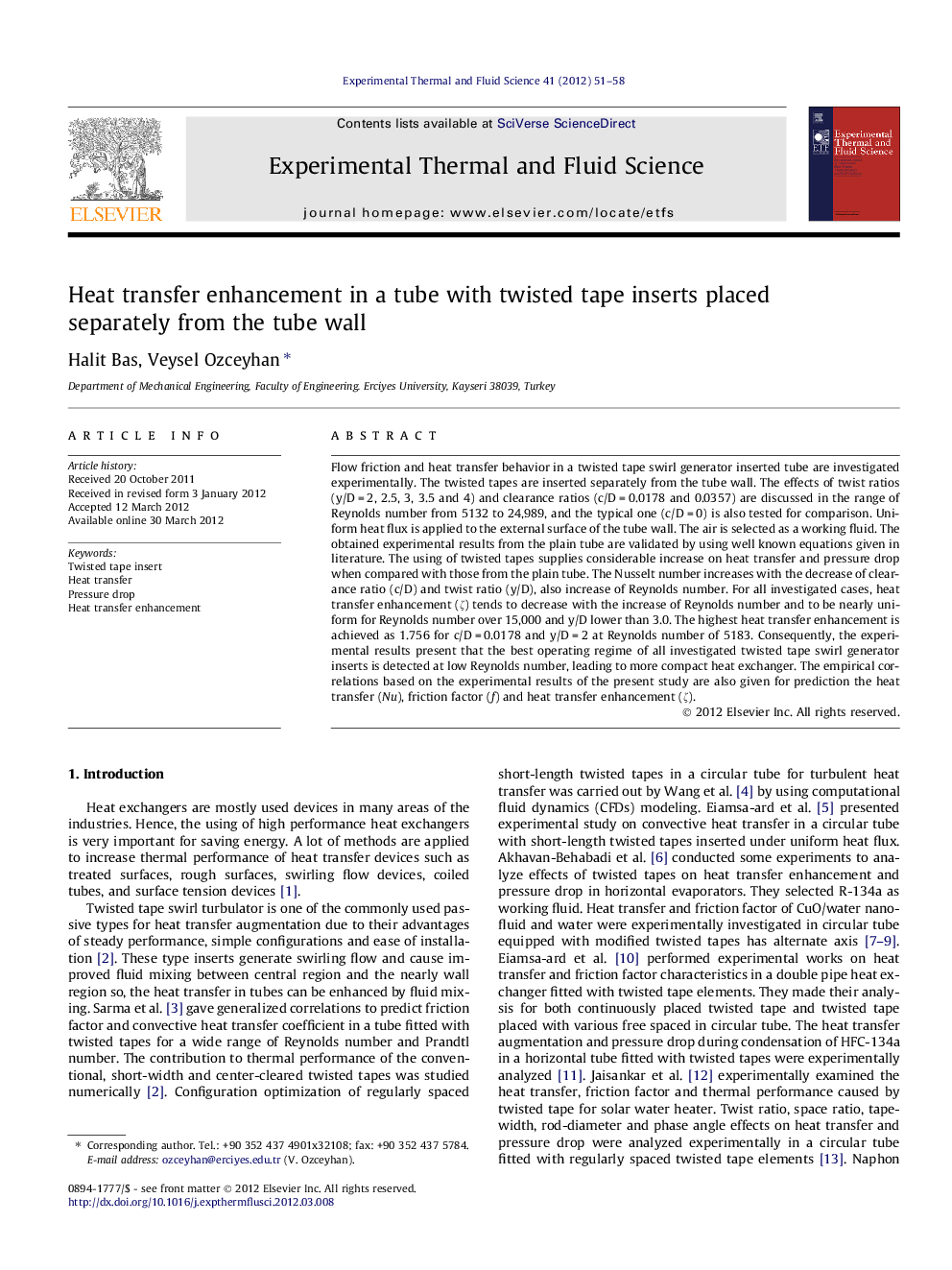 Heat transfer enhancement in a tube with twisted tape inserts placed separately from the tube wall