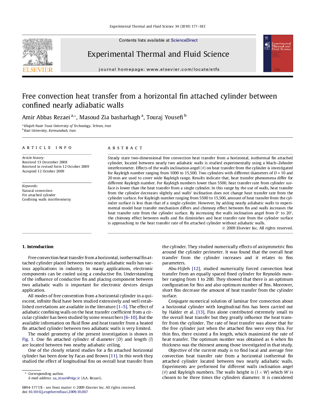 Free convection heat transfer from a horizontal fin attached cylinder between confined nearly adiabatic walls