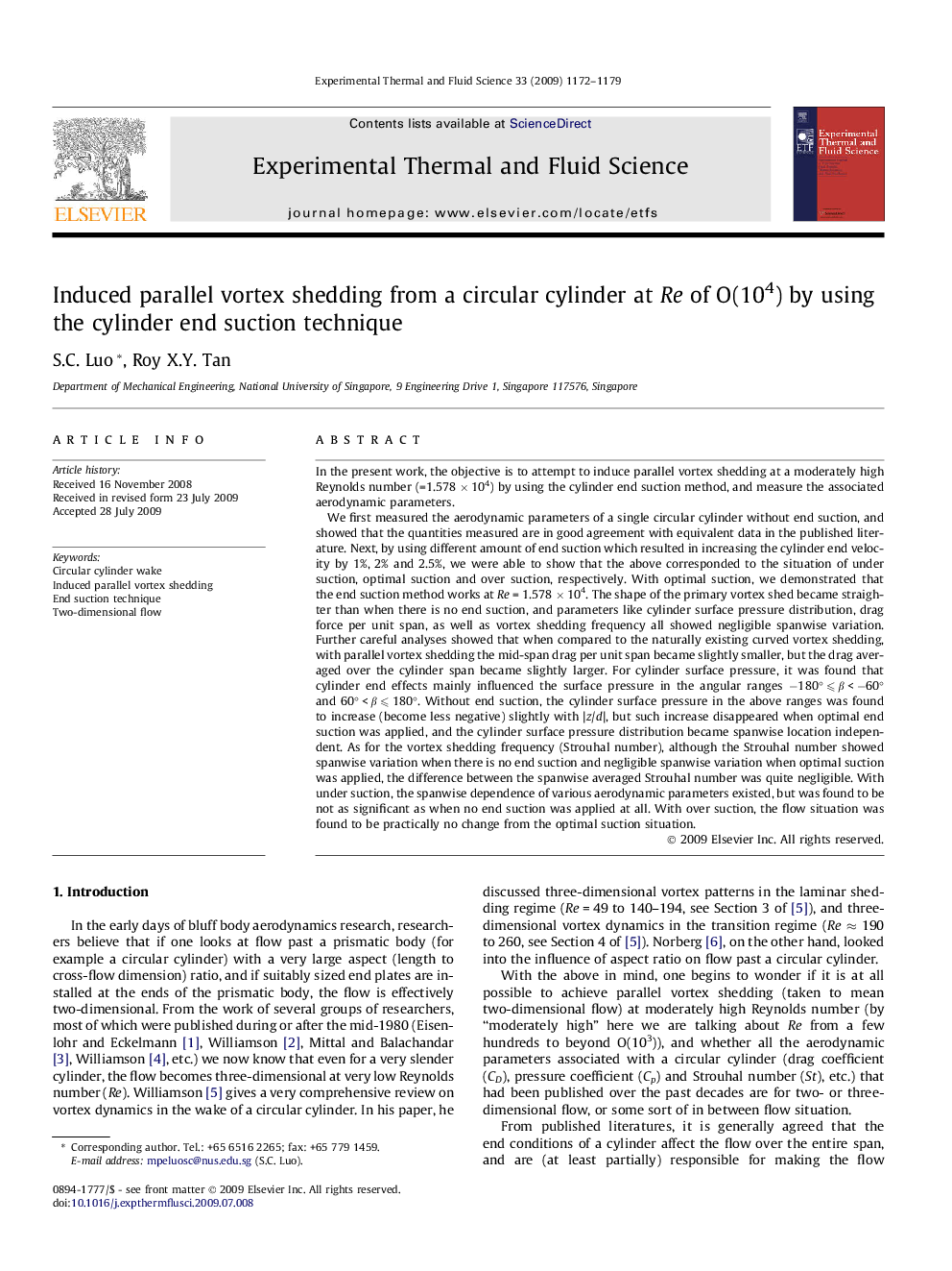 Induced parallel vortex shedding from a circular cylinder at Re of O(104) by using the cylinder end suction technique