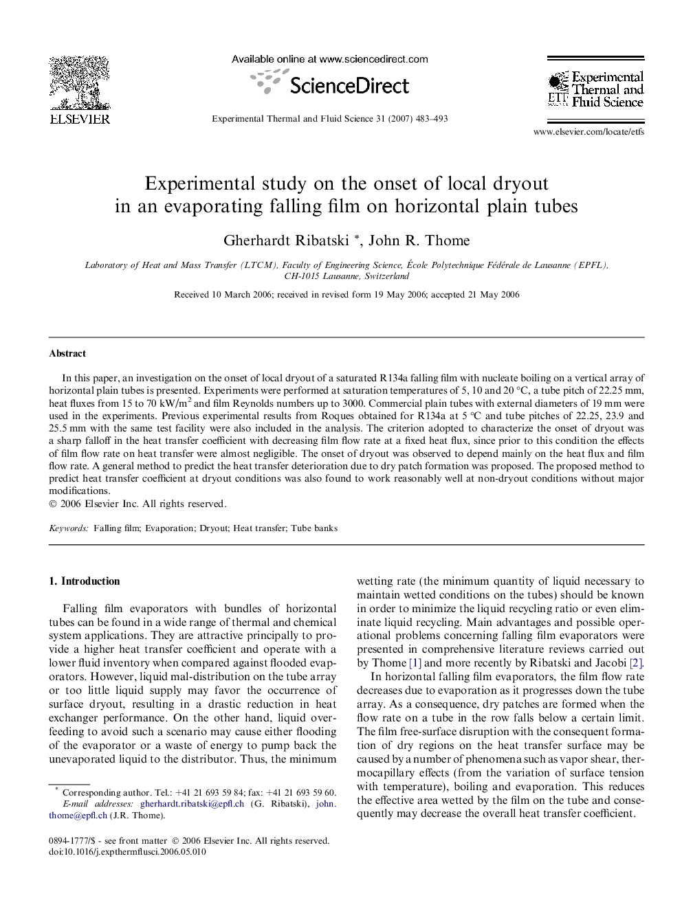 Experimental study on the onset of local dryout in an evaporating falling film on horizontal plain tubes