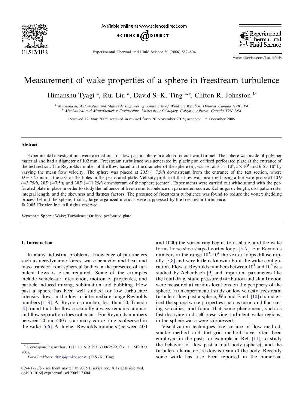 Measurement of wake properties of a sphere in freestream turbulence
