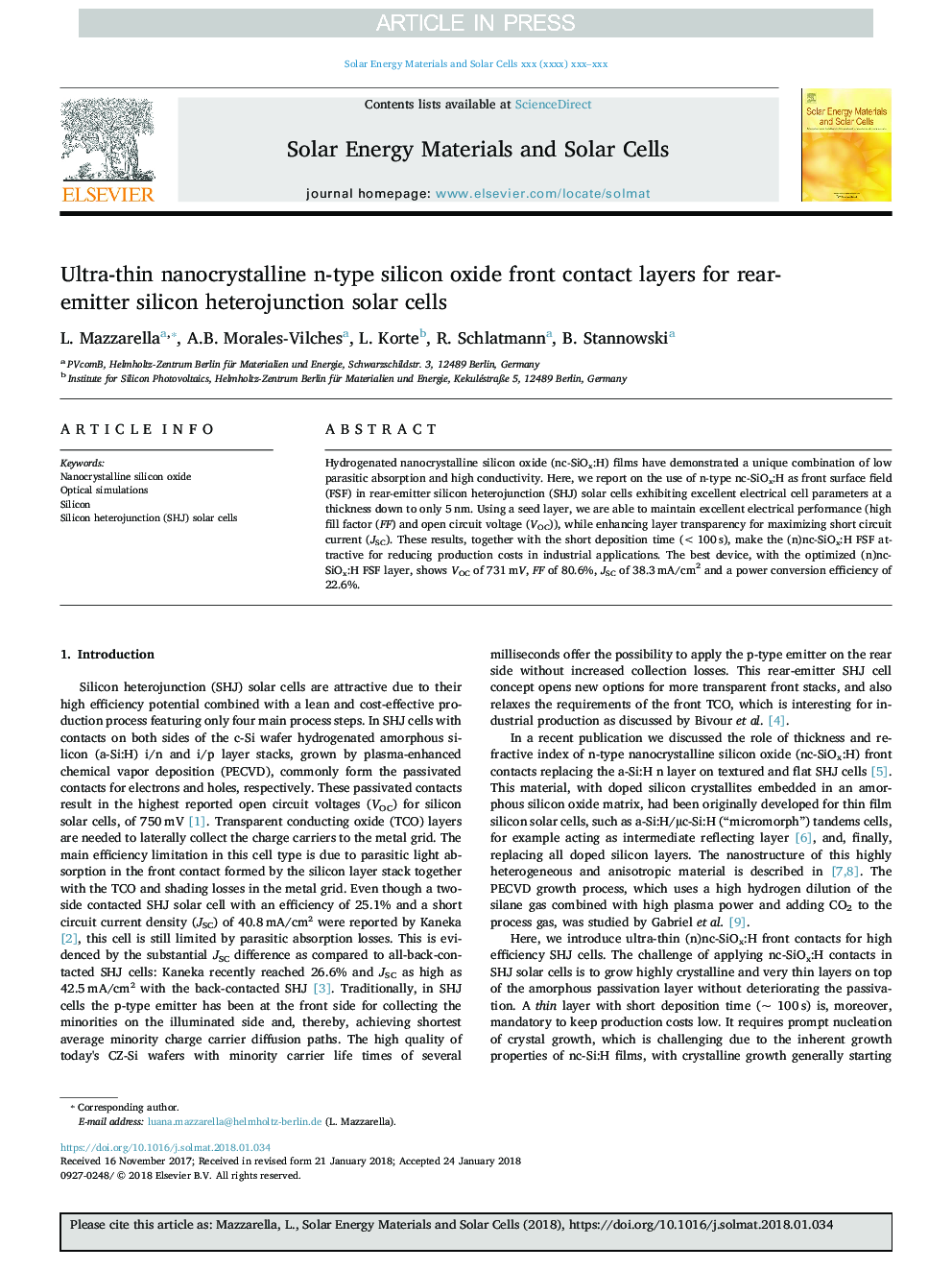 Ultra-thin nanocrystalline n-type silicon oxide front contact layers for rear-emitter silicon heterojunction solar cells