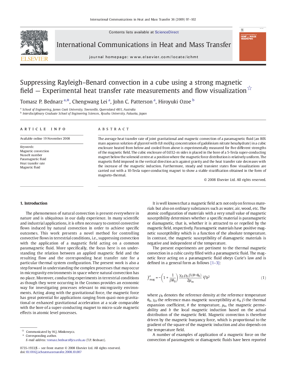 Suppressing Rayleigh–Benard convection in a cube using a strong magnetic field — Experimental heat transfer rate measurements and flow visualization 