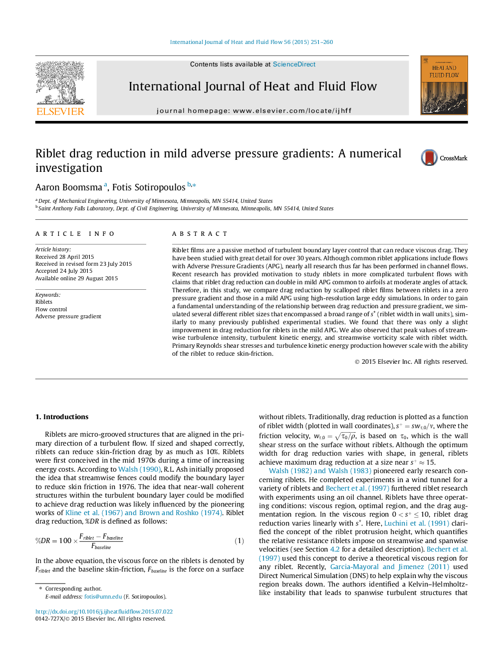 Riblet drag reduction in mild adverse pressure gradients: A numerical investigation