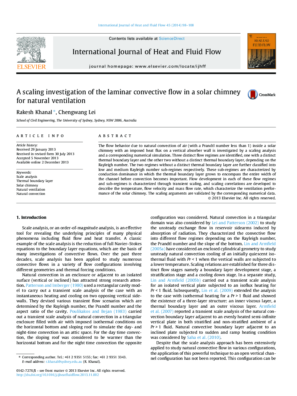 A scaling investigation of the laminar convective flow in a solar chimney for natural ventilation