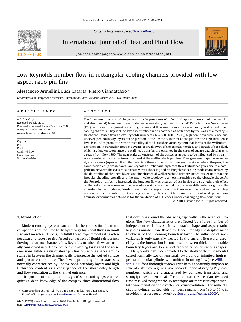 Low Reynolds number flow in rectangular cooling channels provided with low aspect ratio pin fins