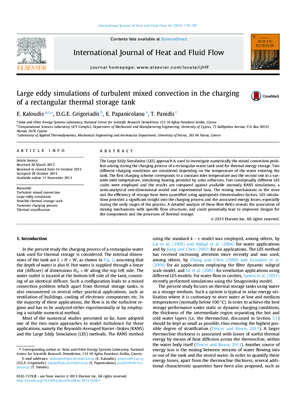 Large eddy simulations of turbulent mixed convection in the charging of a rectangular thermal storage tank