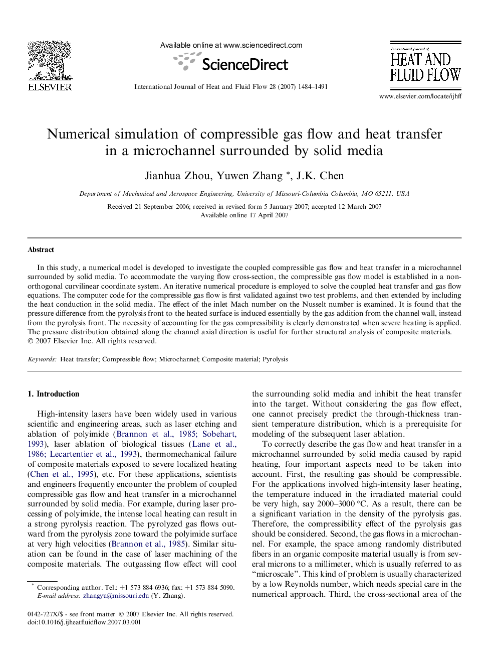 Numerical simulation of compressible gas flow and heat transfer in a microchannel surrounded by solid media