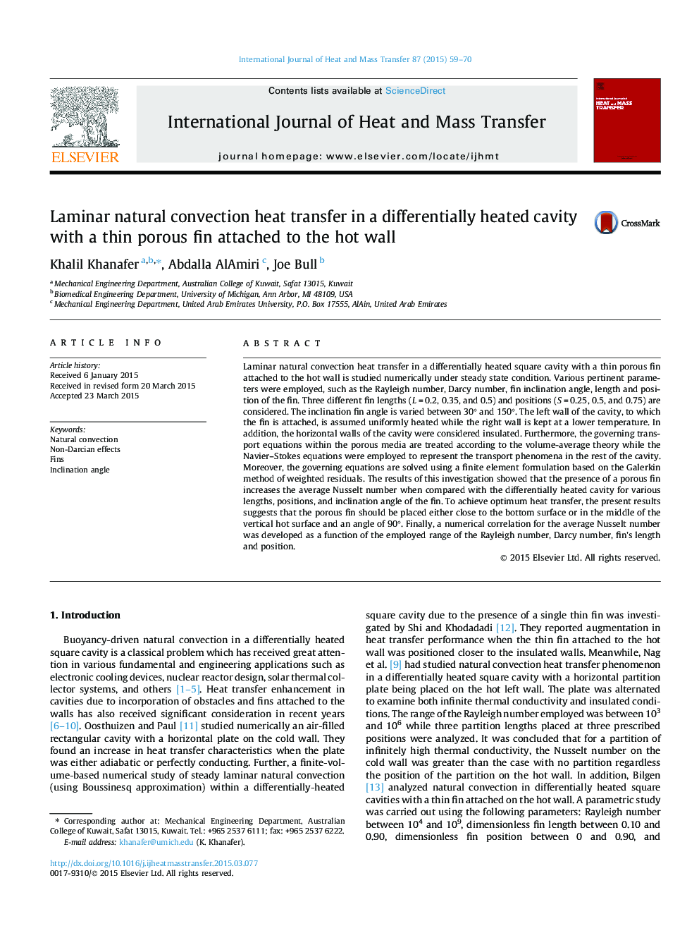 Laminar natural convection heat transfer in a differentially heated cavity with a thin porous fin attached to the hot wall