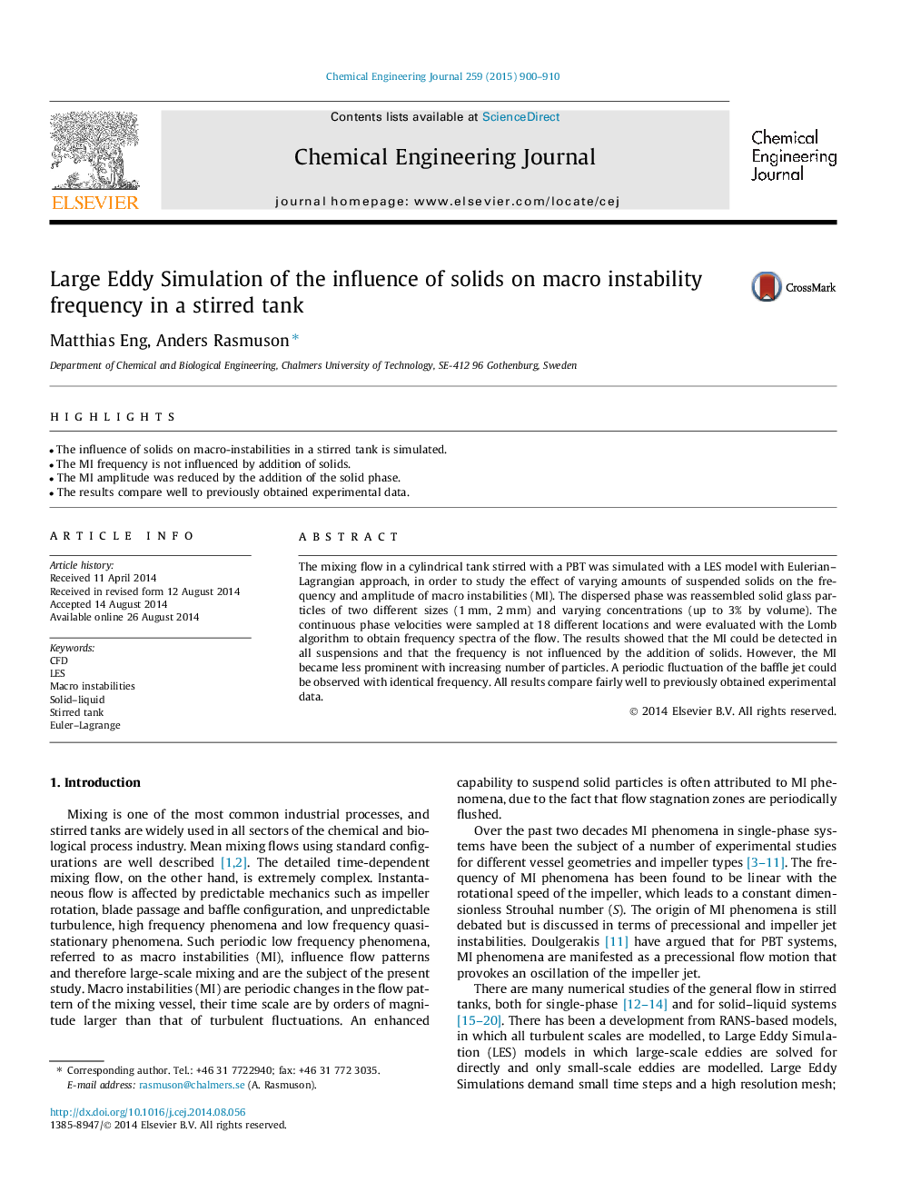 Large Eddy Simulation of the influence of solids on macro instability frequency in a stirred tank