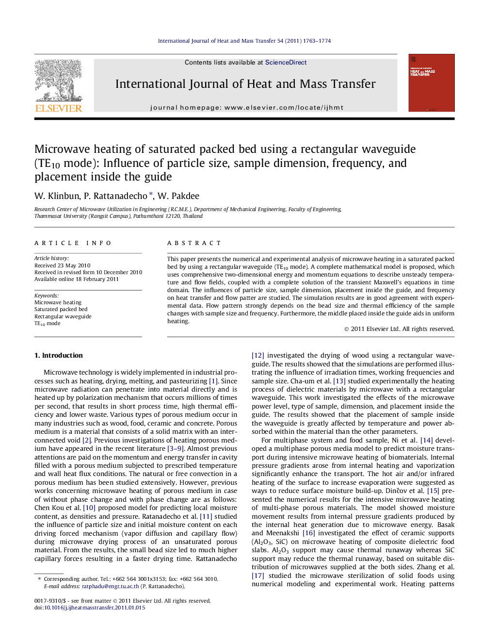 Microwave heating of saturated packed bed using a rectangular waveguide (TE10 mode): Influence of particle size, sample dimension, frequency, and placement inside the guide