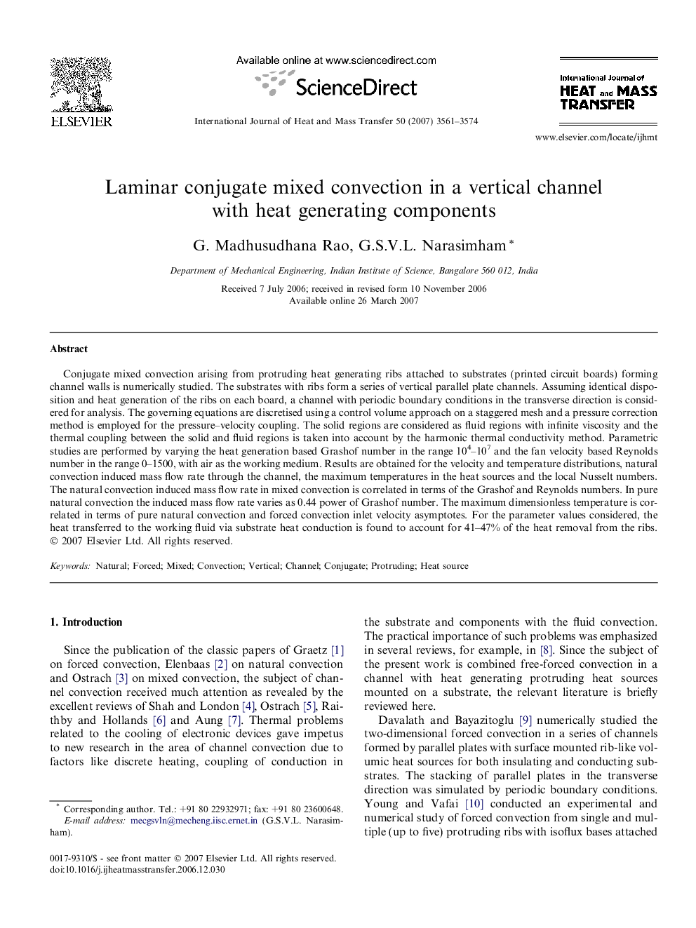 Laminar conjugate mixed convection in a vertical channel with heat generating components