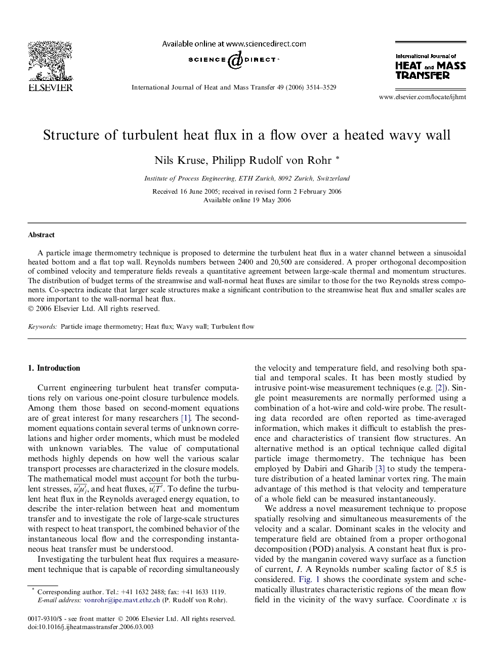 Structure of turbulent heat flux in a flow over a heated wavy wall