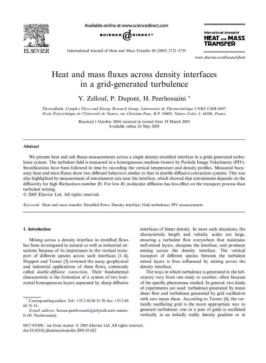 Heat and mass fluxes across density interfaces in a grid-generated turbulence