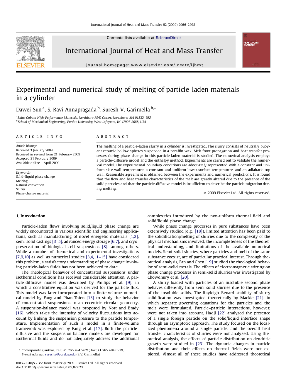 Experimental and numerical study of melting of particle-laden materials in a cylinder