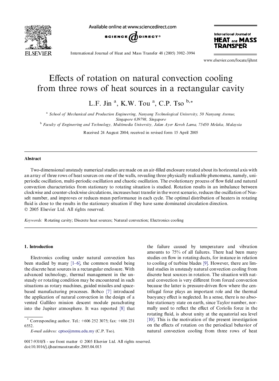 Effects of rotation on natural convection cooling from three rows of heat sources in a rectangular cavity