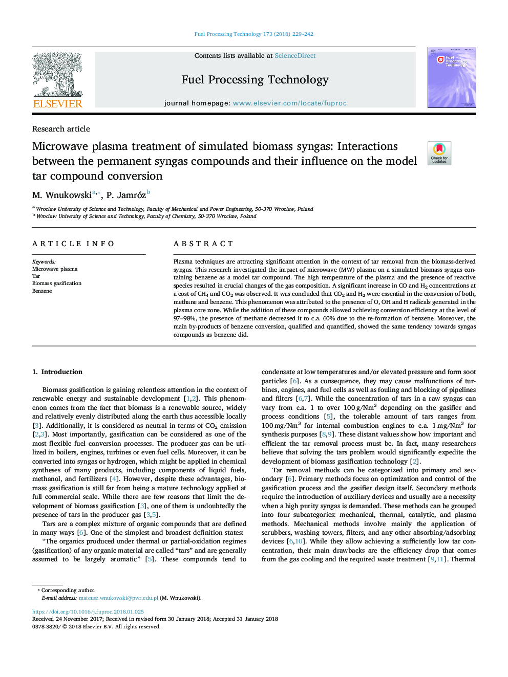 Microwave plasma treatment of simulated biomass syngas: Interactions between the permanent syngas compounds and their influence on the model tar compound conversion