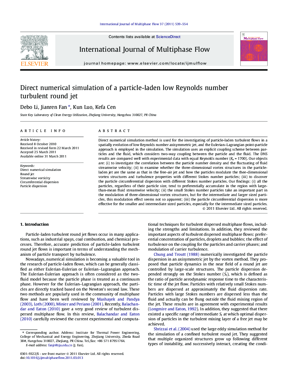 Direct numerical simulation of a particle-laden low Reynolds number turbulent round jet