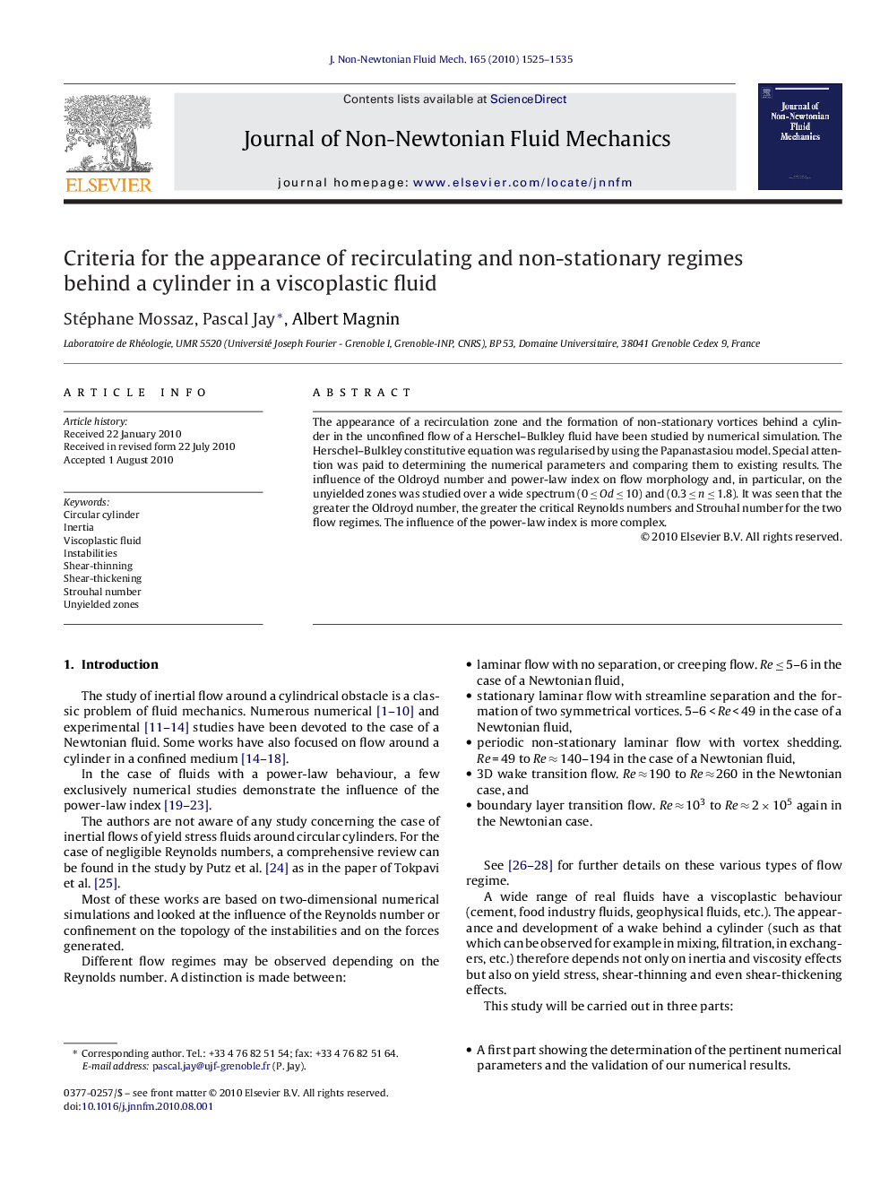 Criteria for the appearance of recirculating and non-stationary regimes behind a cylinder in a viscoplastic fluid