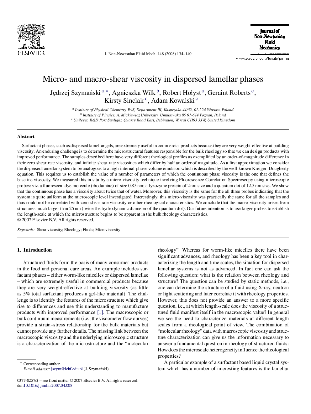Micro- and macro-shear viscosity in dispersed lamellar phases