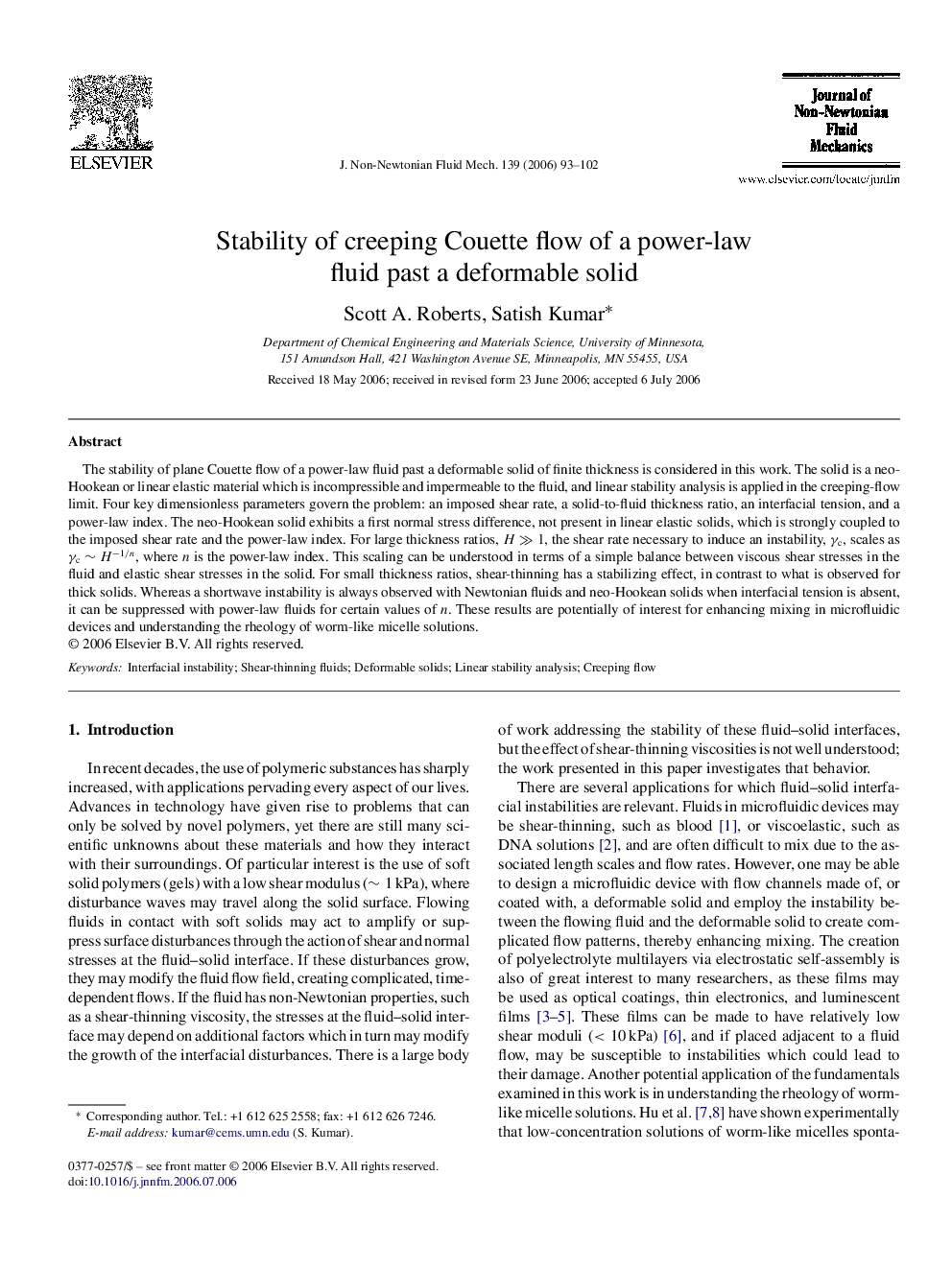 Stability of creeping Couette flow of a power-law fluid past a deformable solid