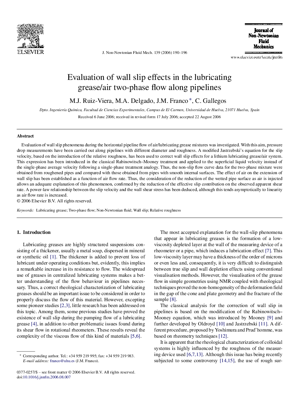 Evaluation of wall slip effects in the lubricating grease/air two-phase flow along pipelines