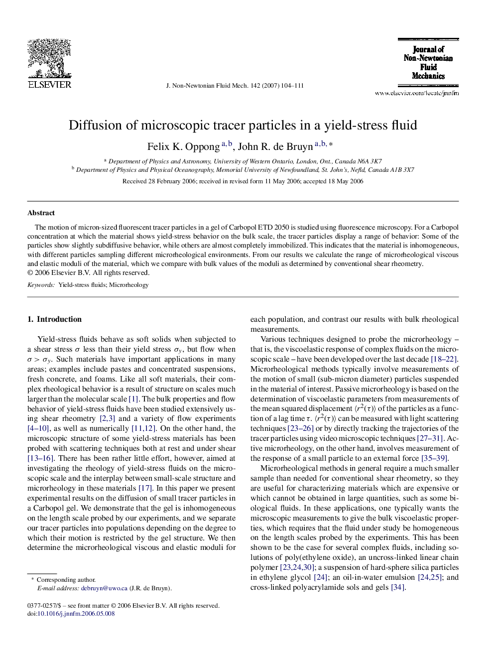 Diffusion of microscopic tracer particles in a yield-stress fluid