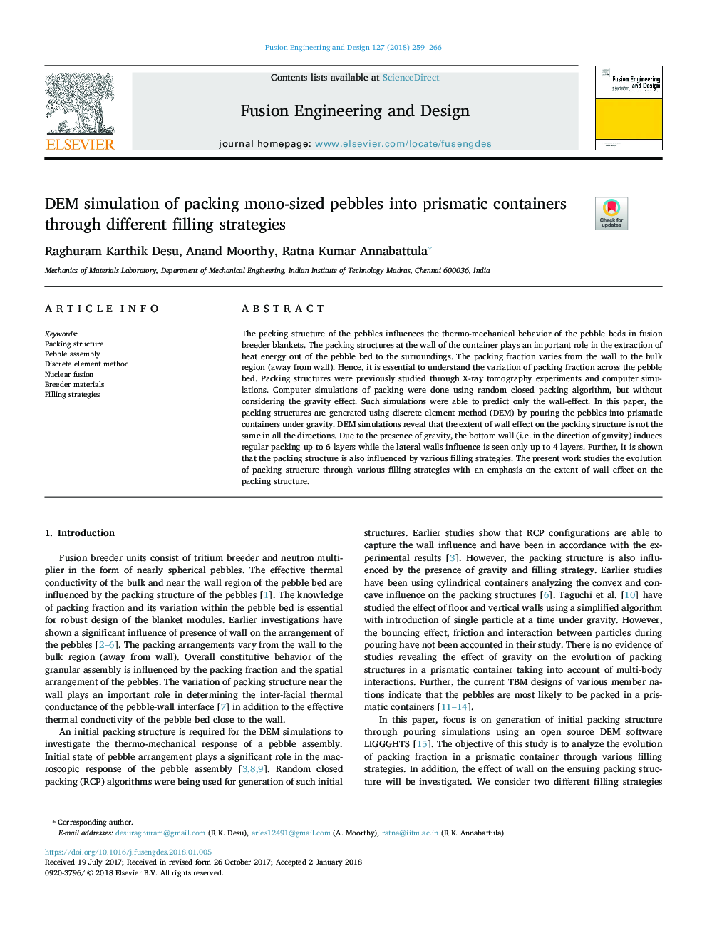 DEM simulation of packing mono-sized pebbles into prismatic containers through different filling strategies