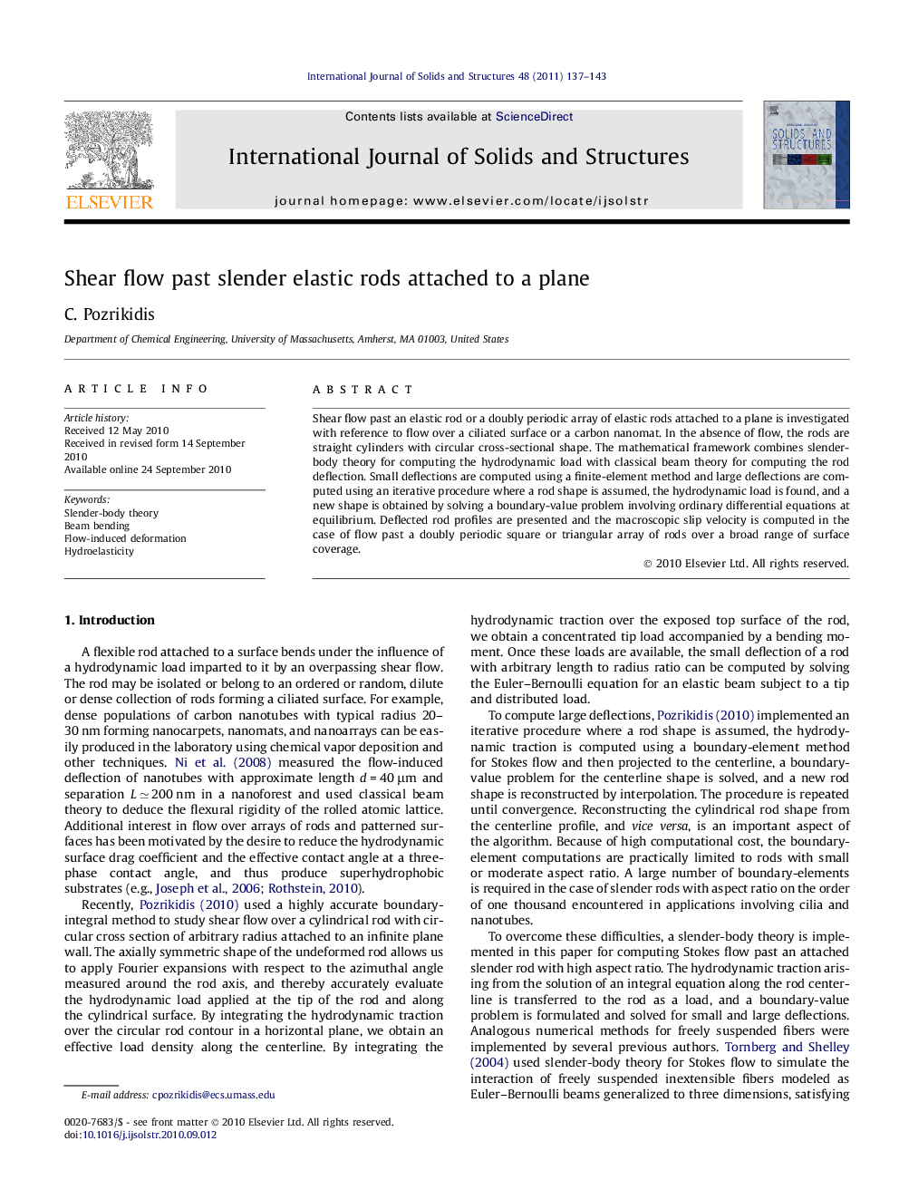 Shear flow past slender elastic rods attached to a plane