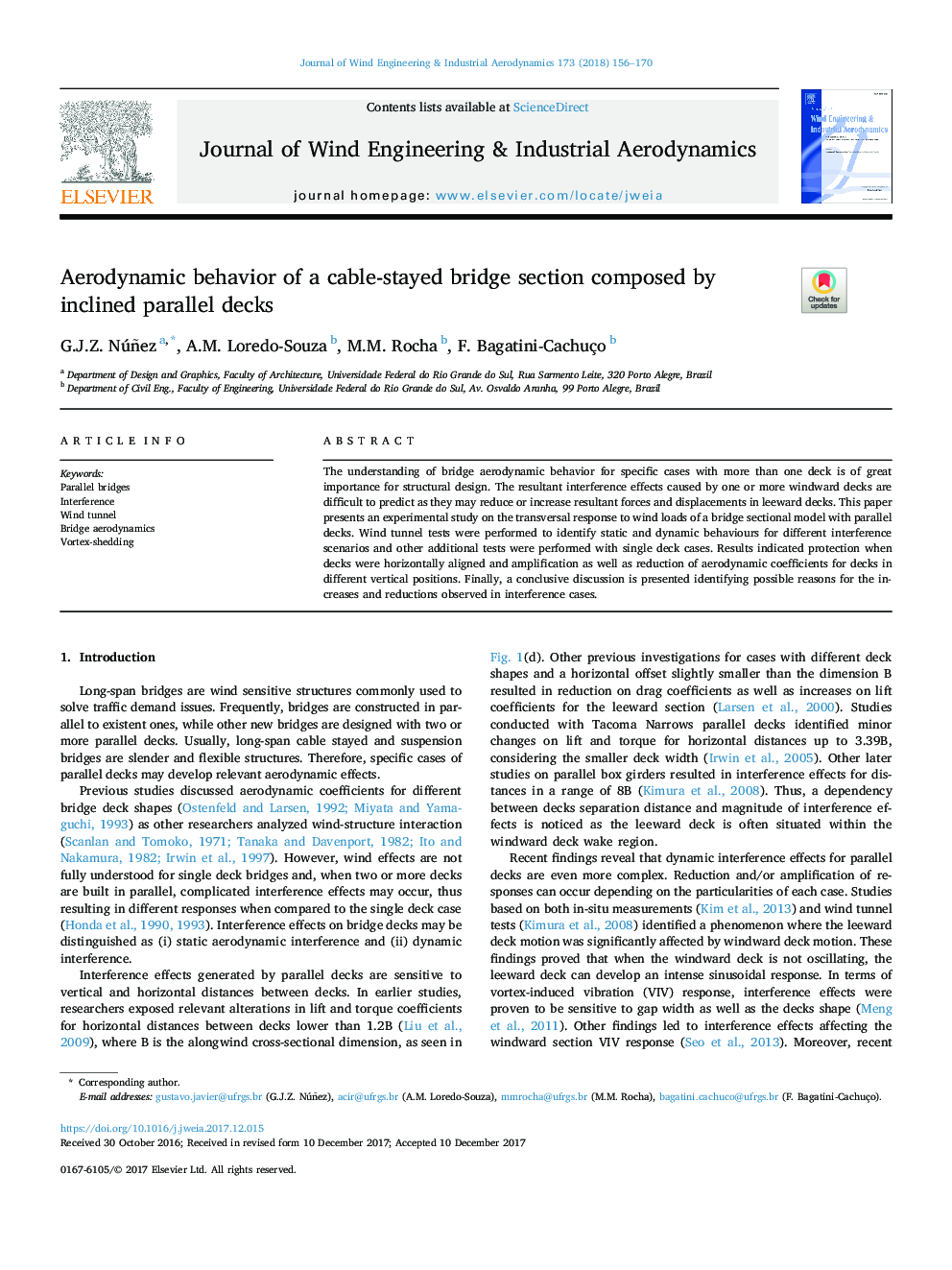 Aerodynamic behavior of a cable-stayed bridge section composed by inclined parallel decks