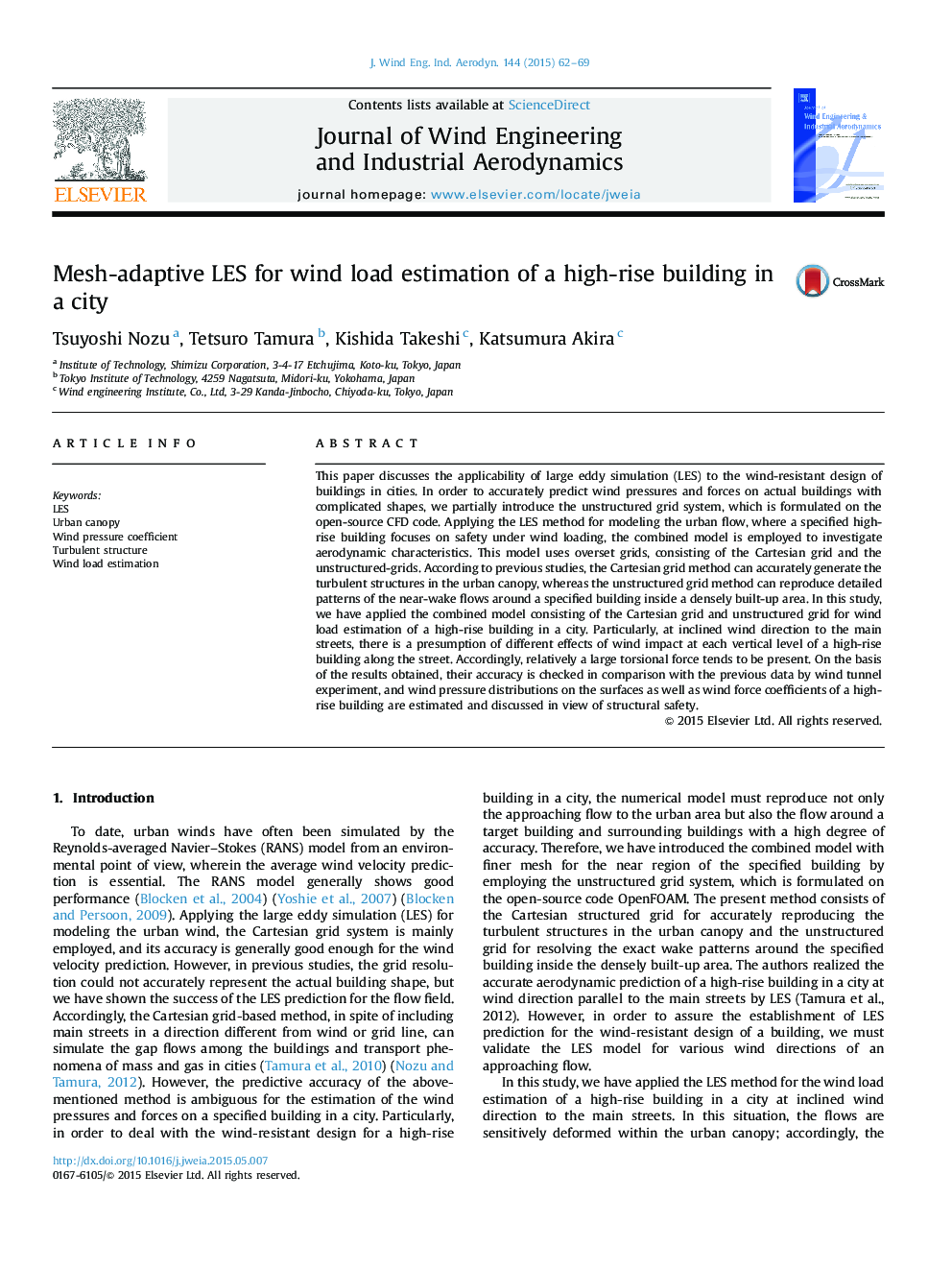 Mesh-adaptive LES for wind load estimation of a high-rise building in a city