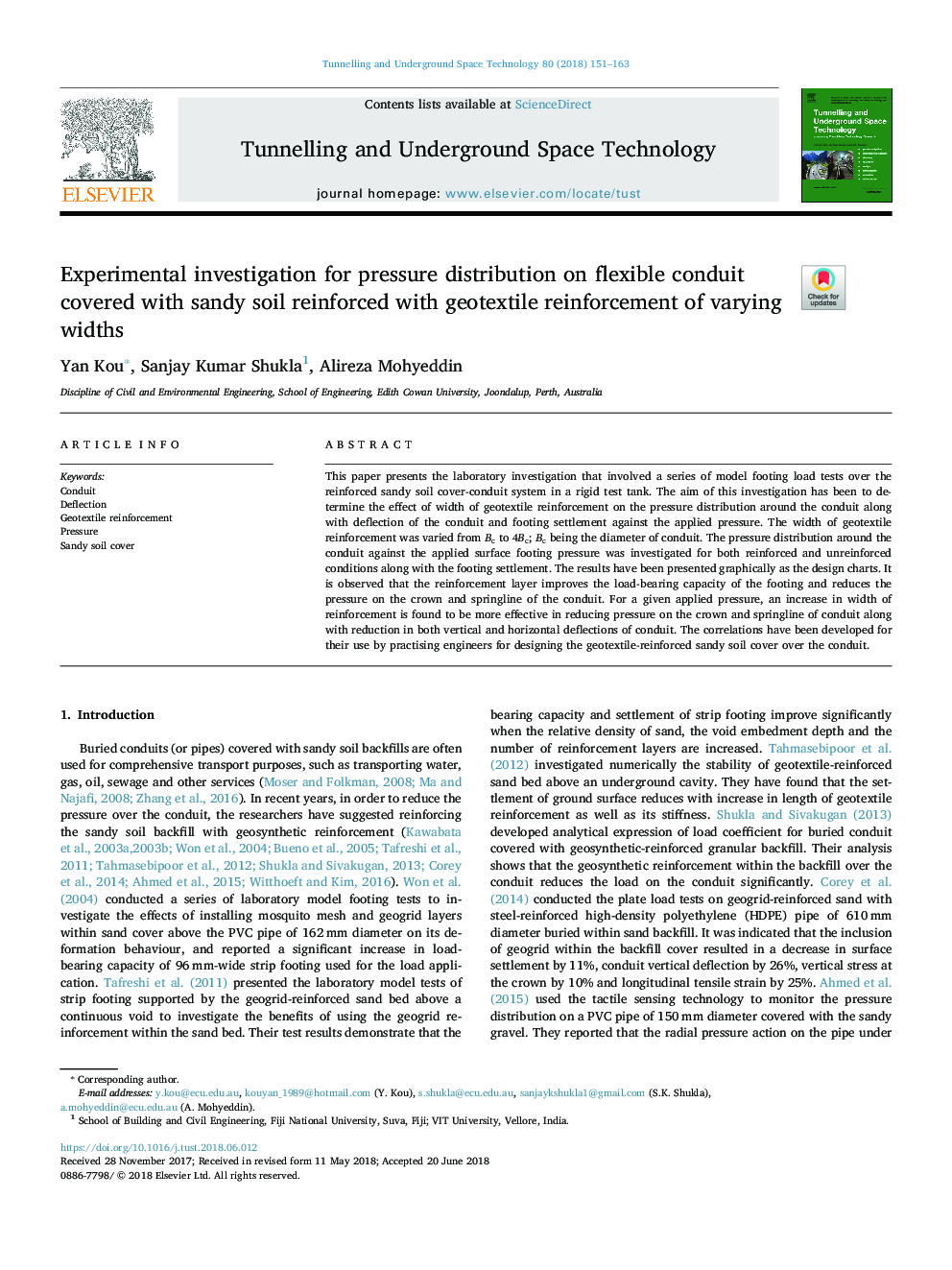 Experimental investigation for pressure distribution on flexible conduit covered with sandy soil reinforced with geotextile reinforcement of varying widths