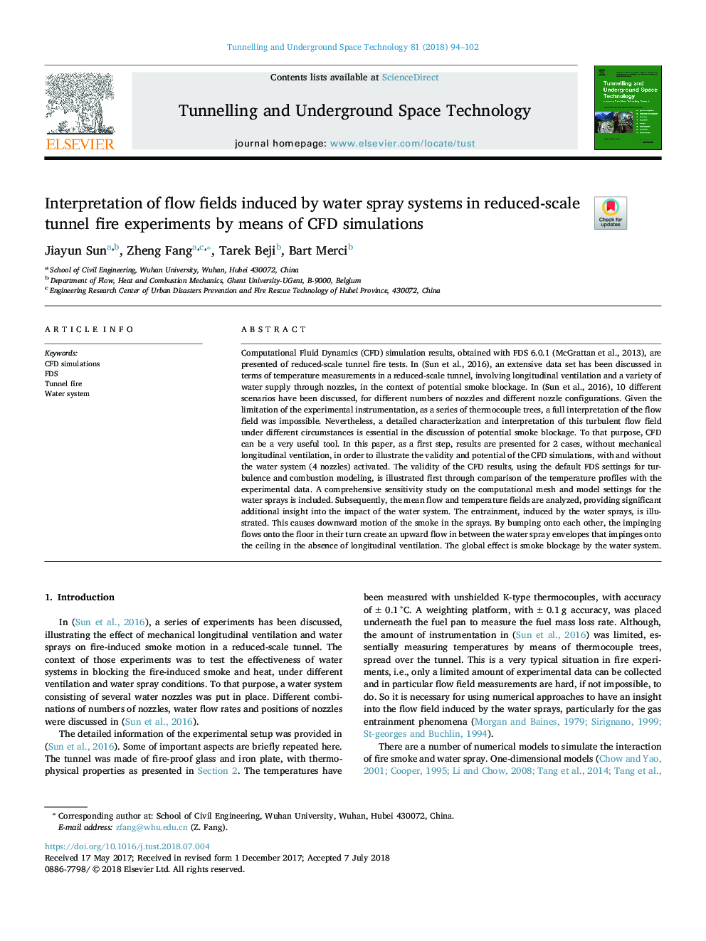 Interpretation of flow fields induced by water spray systems in reduced-scale tunnel fire experiments by means of CFD simulations