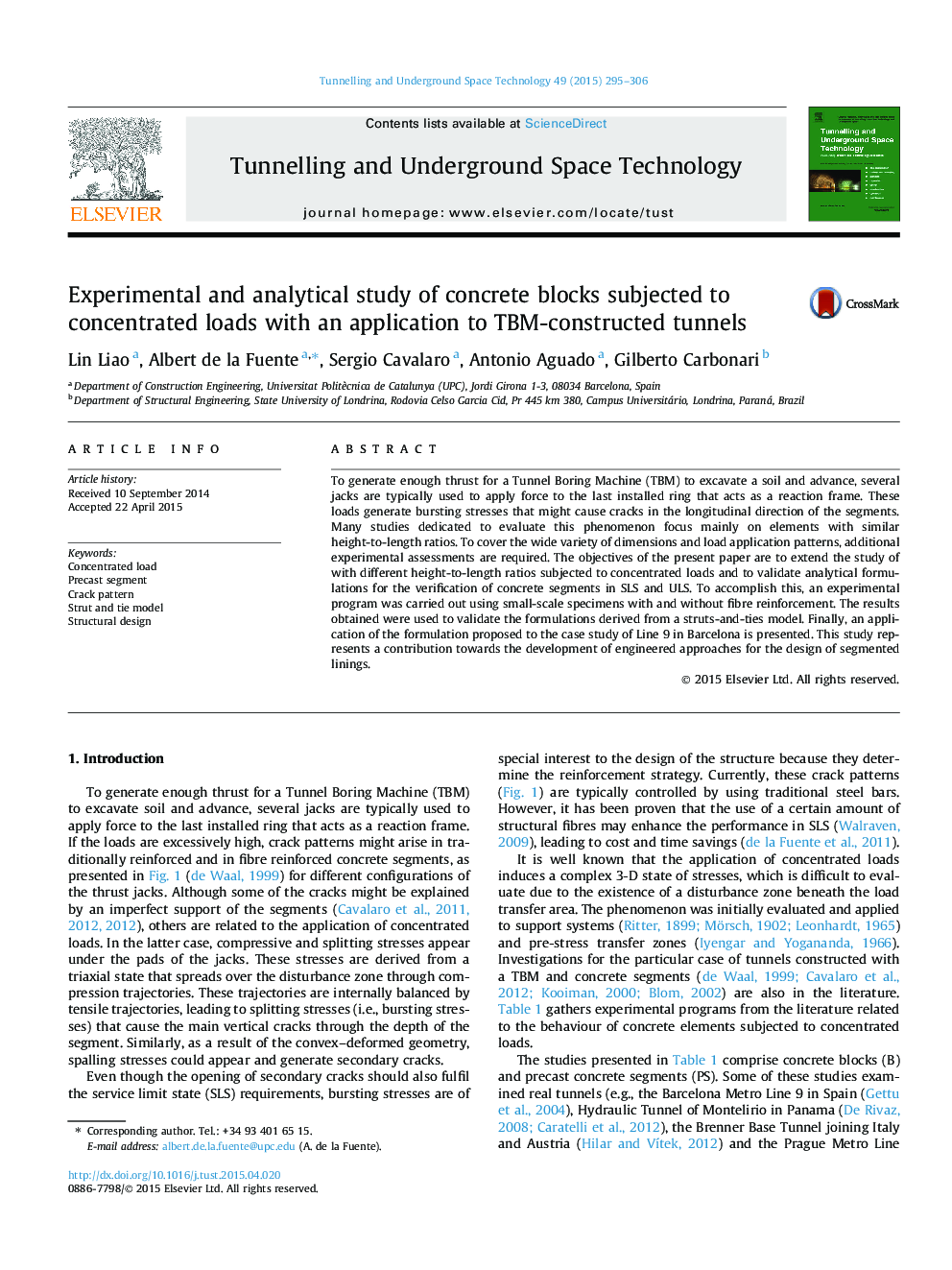 Experimental and analytical study of concrete blocks subjected to concentrated loads with an application to TBM-constructed tunnels