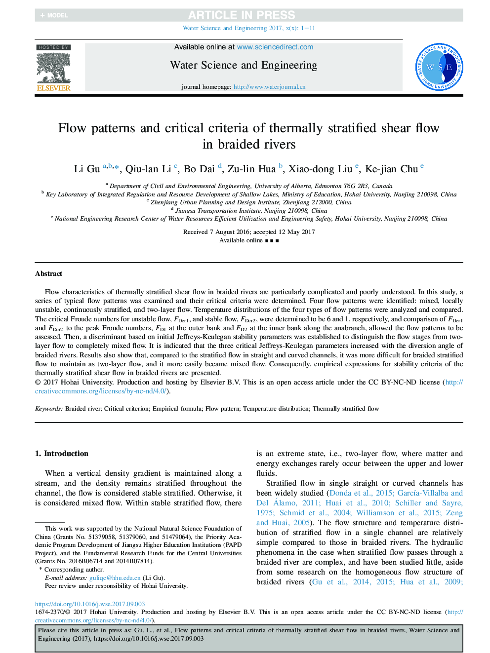 Flow patterns and critical criteria of thermally stratified shear flow in braided rivers