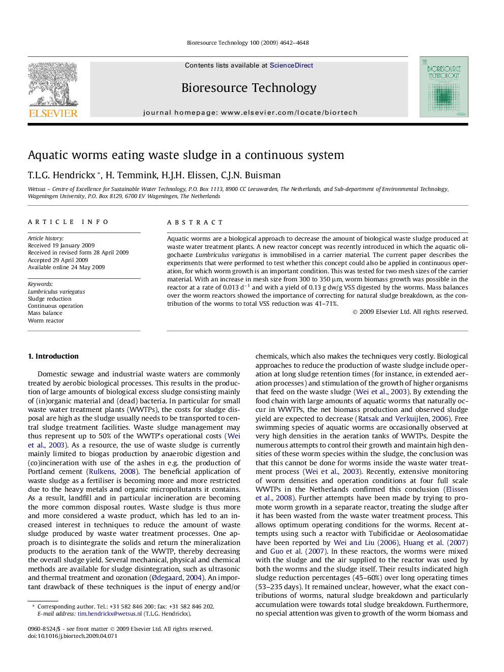 Aquatic worms eating waste sludge in a continuous system