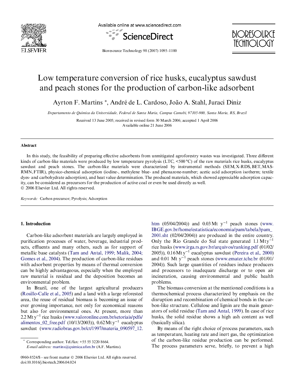 Low temperature conversion of rice husks, eucalyptus sawdust and peach stones for the production of carbon-like adsorbent