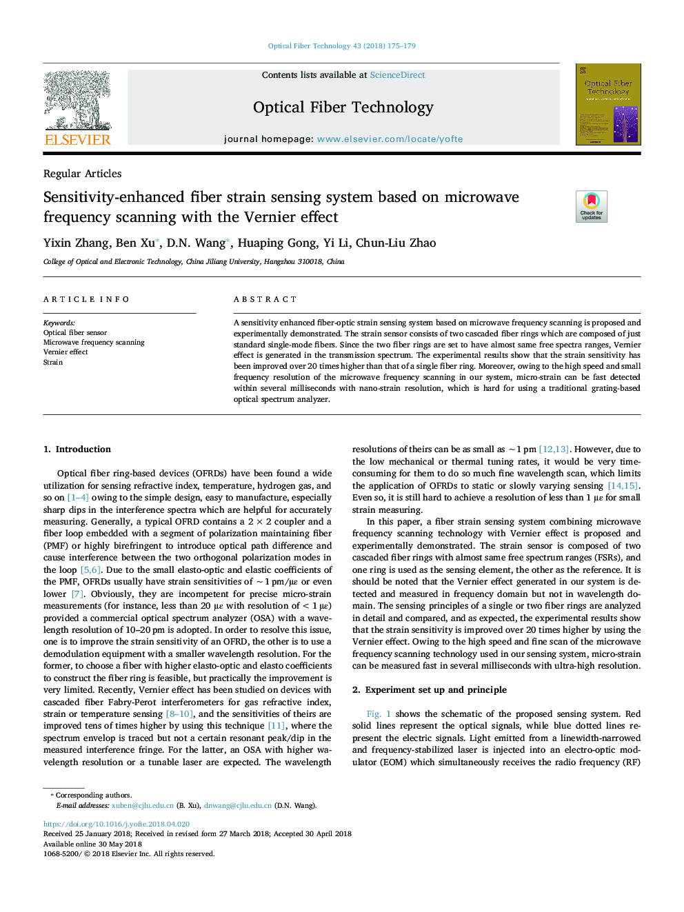 Sensitivity-enhanced fiber strain sensing system based on microwave frequency scanning with the Vernier effect