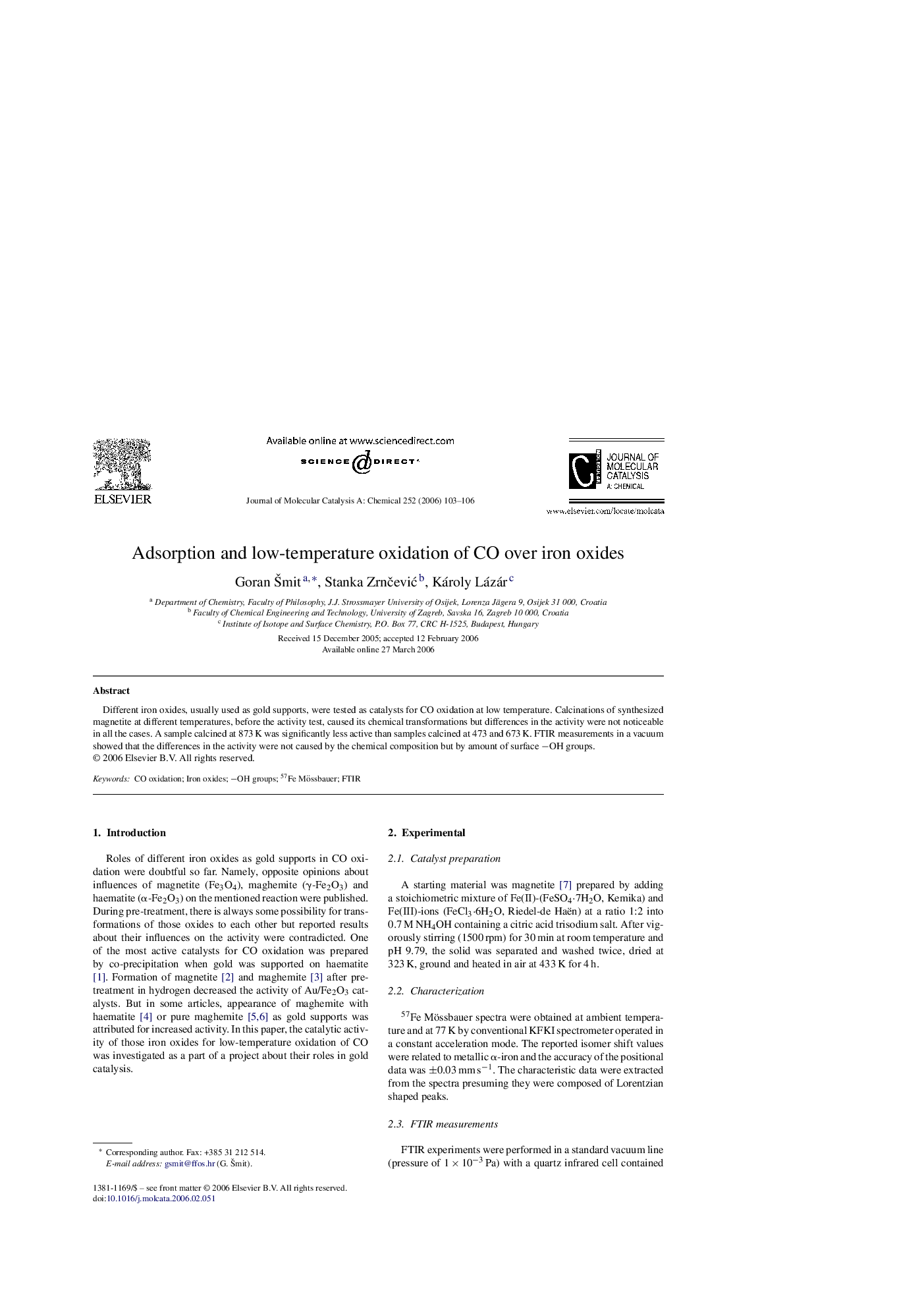 Adsorption and low-temperature oxidation of CO over iron oxides