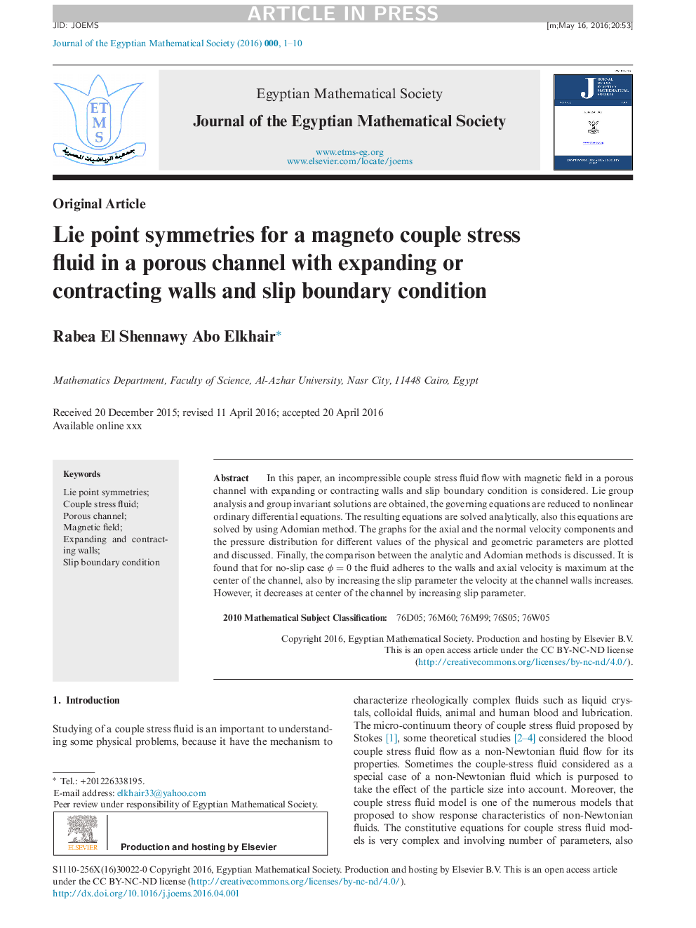 Lie point symmetries for a magneto couple stress fluid in a porous channel with expanding or contracting walls and slip boundary condition