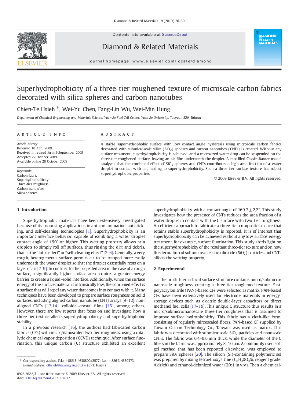 Superhydrophobicity of a three-tier roughened texture of microscale carbon fabrics decorated with silica spheres and carbon nanotubes