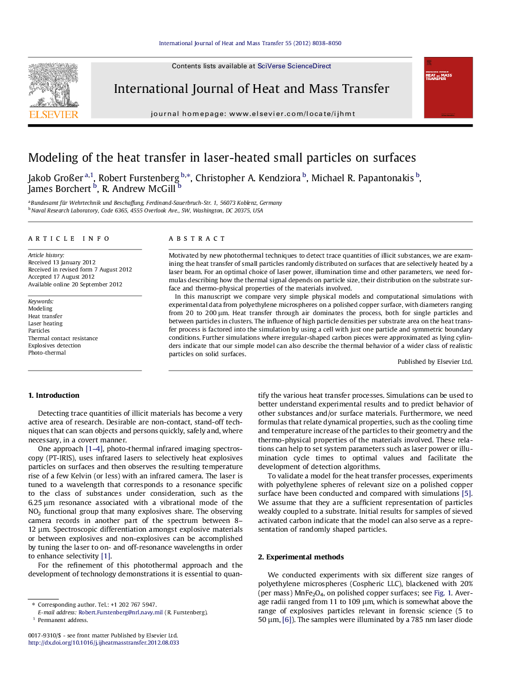 Modeling of the heat transfer in laser-heated small particles on surfaces