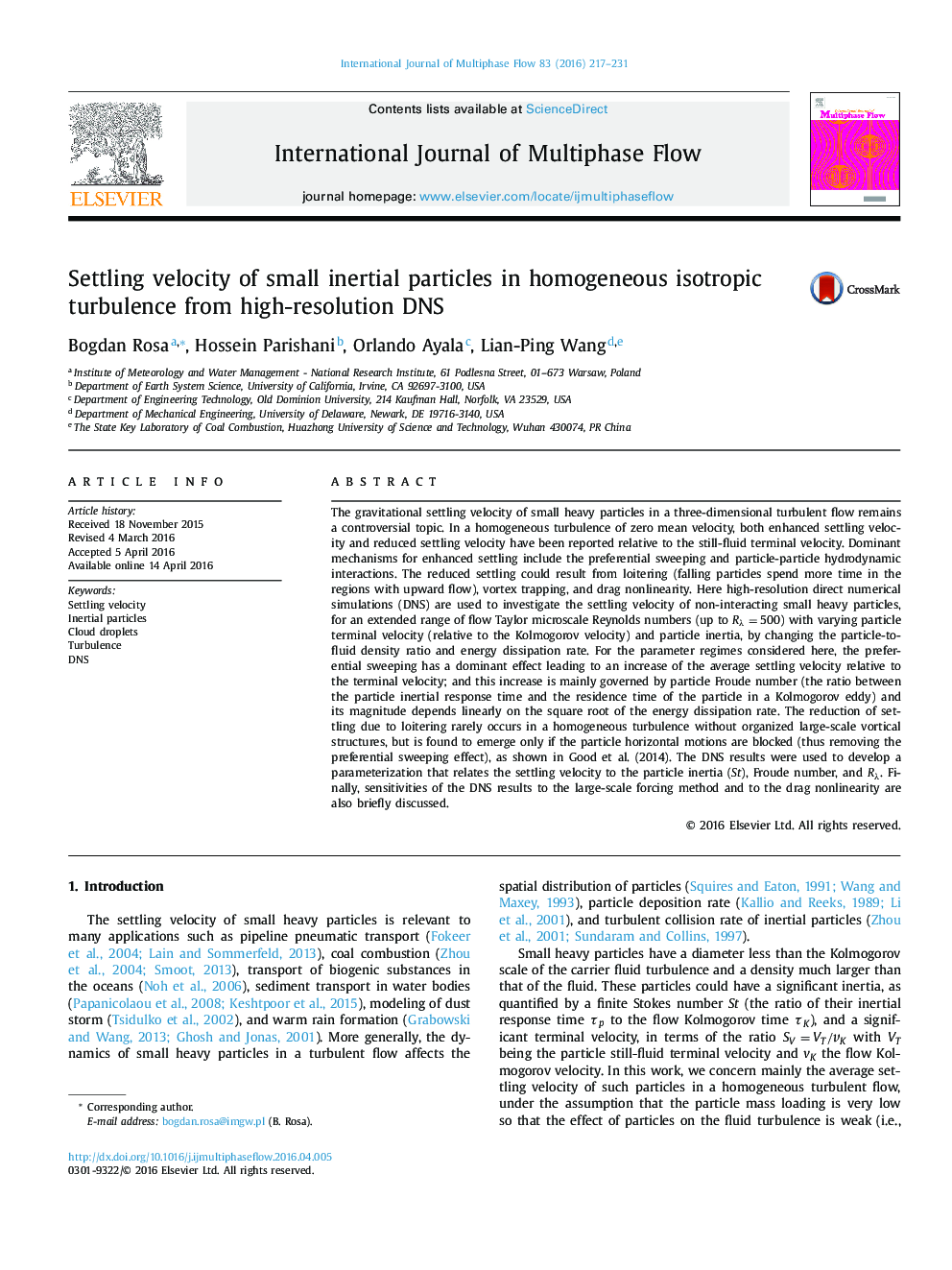 Settling velocity of small inertial particles in homogeneous isotropic turbulence from high-resolution DNS