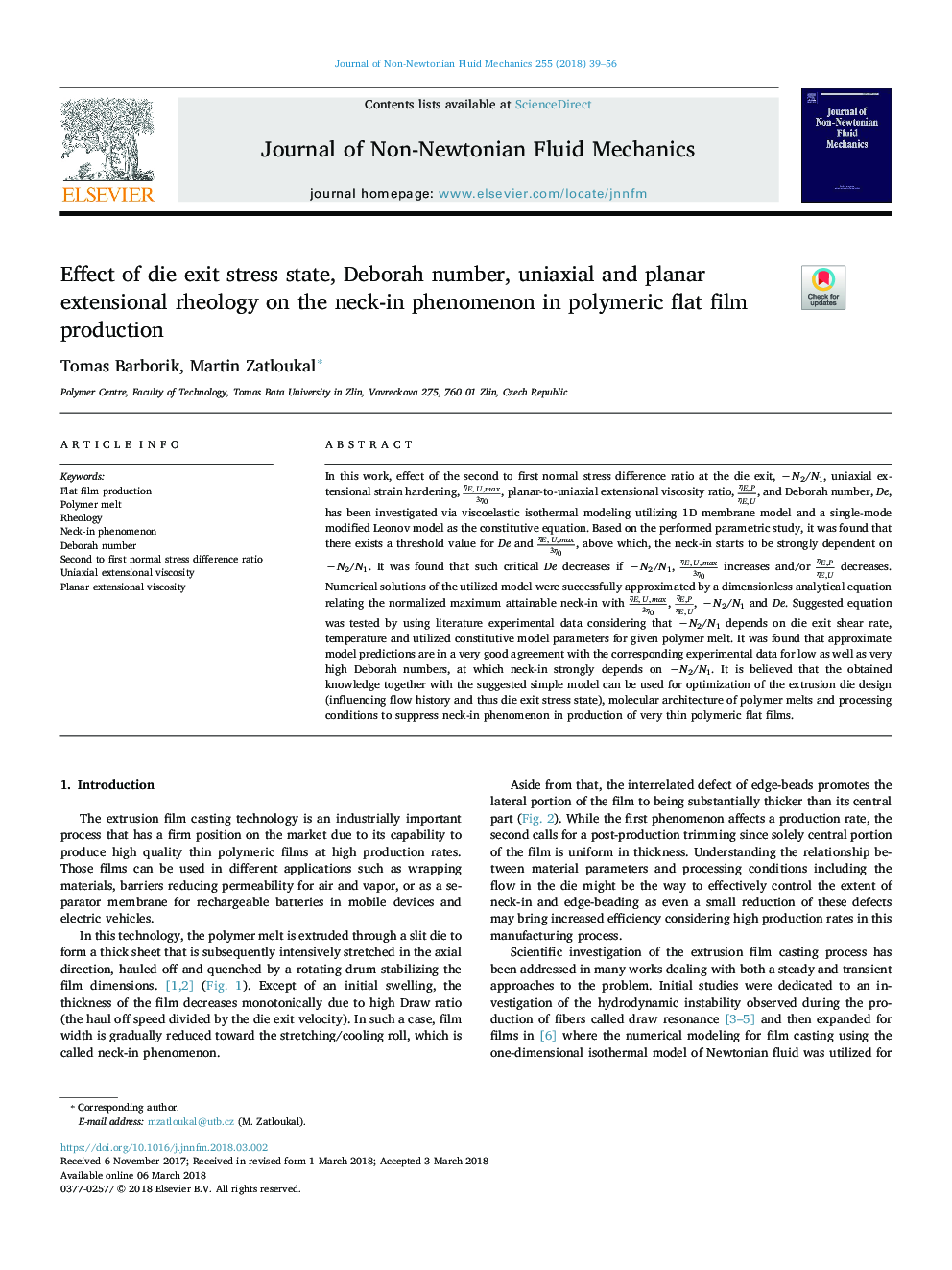 Effect of die exit stress state, Deborah number, uniaxial and planar extensional rheology on the neck-in phenomenon in polymeric flat film production